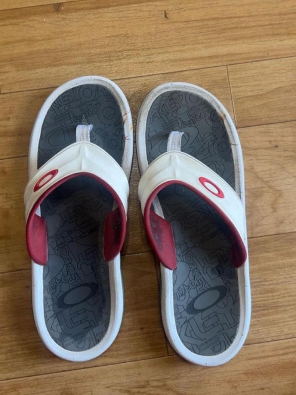 OakleyWhite and Red Slide Sandals